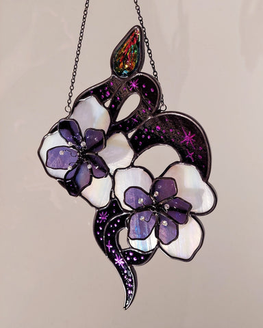 Snake with flowers and rainbow crystal prism